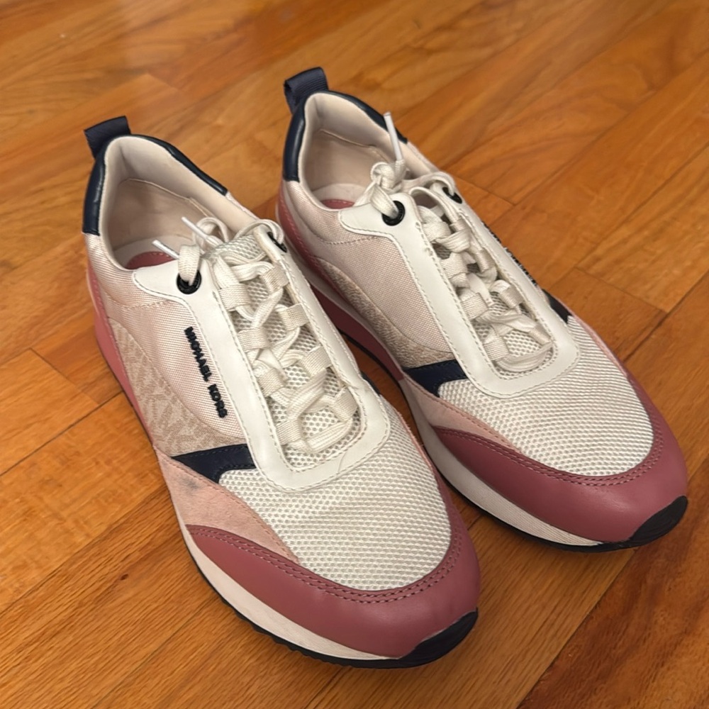 Michael Kors tennis shoes. Only worn a couple of times. One scuff mark, last pic